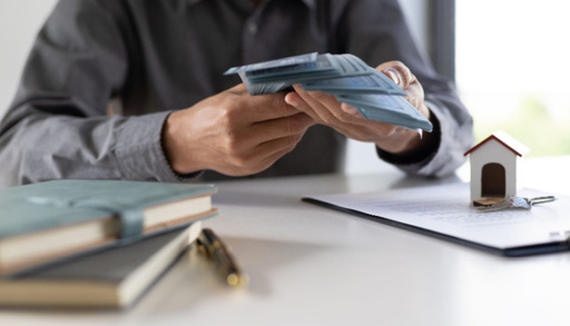 real-estate-agent-businessman-holding-cash.jpg